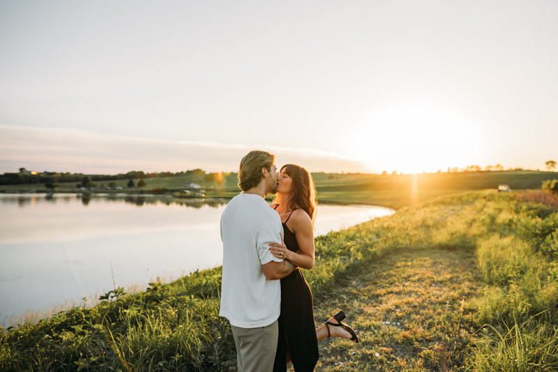 Couple at golden sunset by the lake
