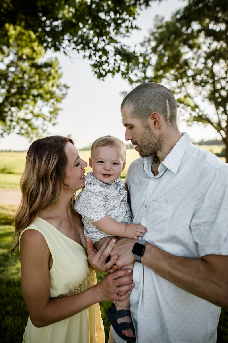 Young family together at golden hour